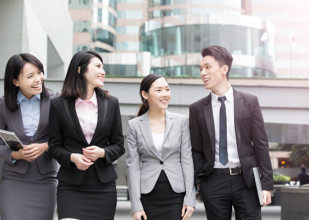 istock businesspeople talk in office 614322784