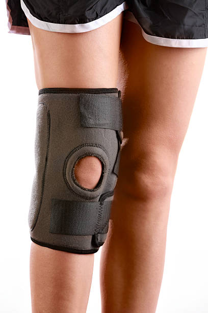 istock Woman Wearing Knee Brace 614322822