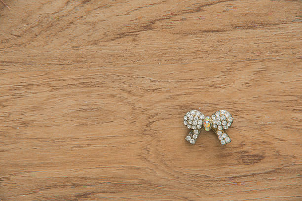 istock jewelry in wood background 614324770