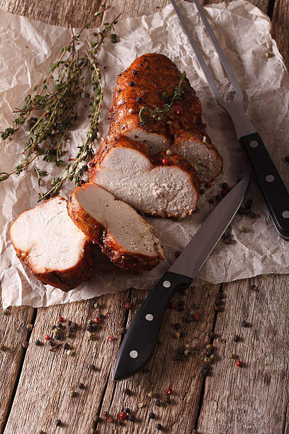 istock Turkey fillet roasted close-up on the table. Vertical 614325282