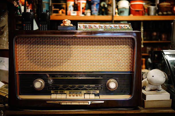 istock table with an old vintage radio in cafe 614325346