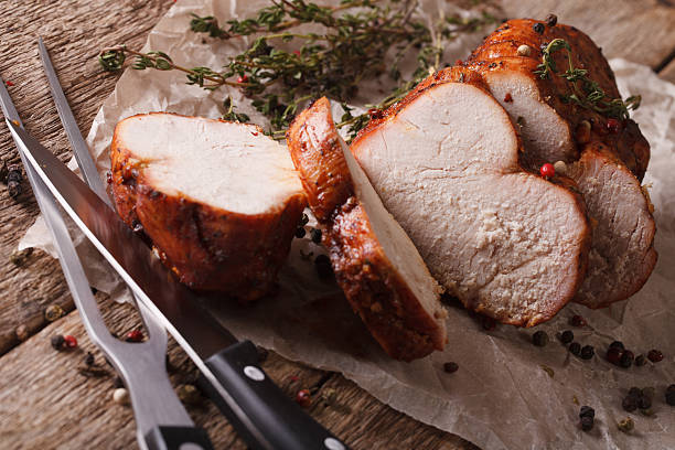 istock homemade sliced roasted turkey close-up on paper. horizontal 614325846