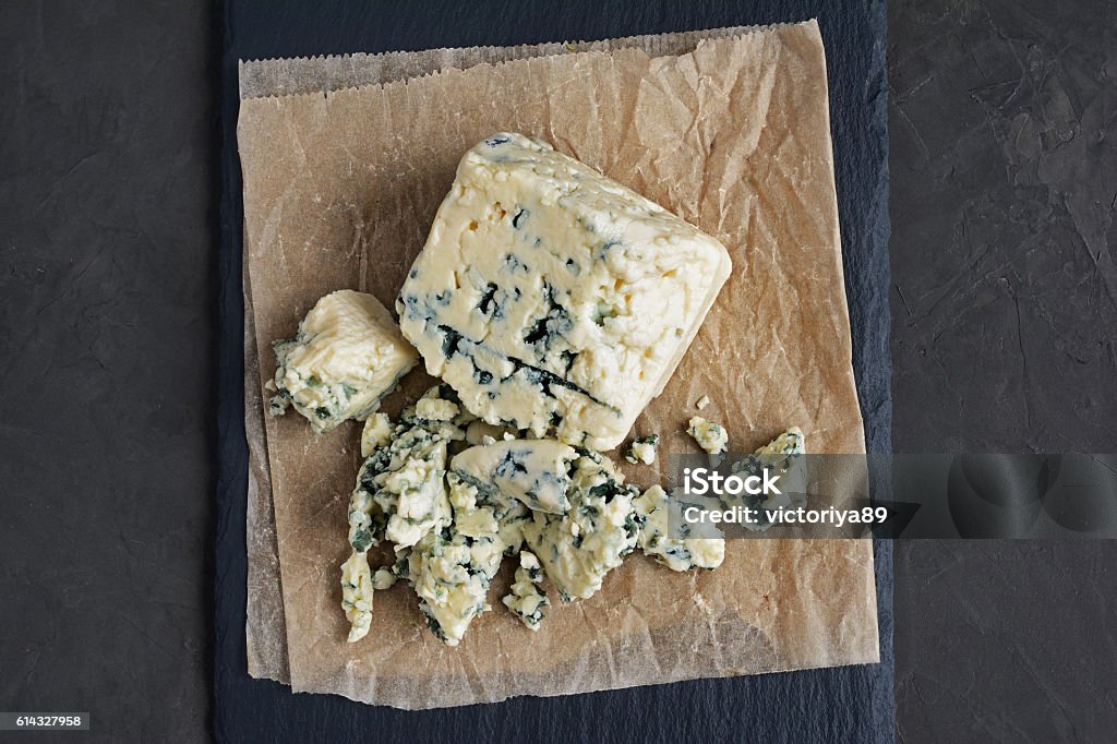 Delicious blue cheese Delicious blue cheese on black slate background Gorgonzola Stock Photo