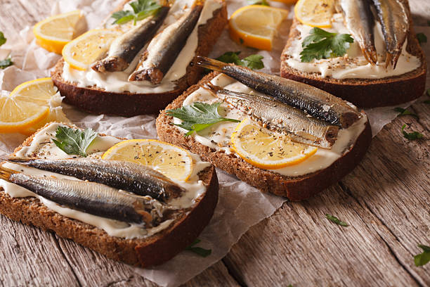 istock fish sandwiches with cream cheese and lemon close-up. horizontal 614332260