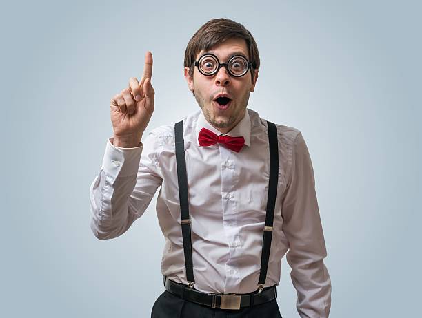 Funny nerd or geek have an idea. Funny nerd or geek have an idea and holds finger up. nerd stock pictures, royalty-free photos & images