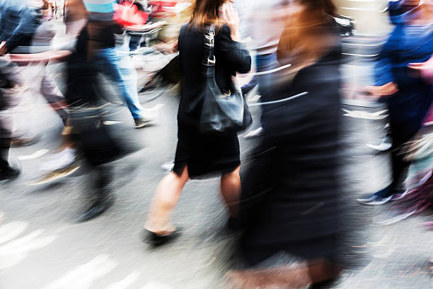 istock crowd of people in motion blur 614333342