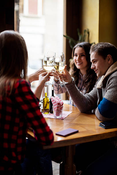istock Group of friends toasting with wine glasses 614333760