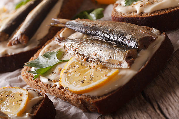 istock fish Sandwiches with sprats and cream cheese close-up. Horizontal 614334080