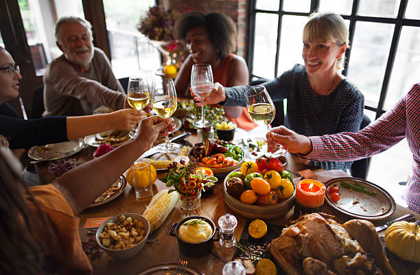 istock People Cheers Celebrating Thanksgiving Holiday Concept 614334952