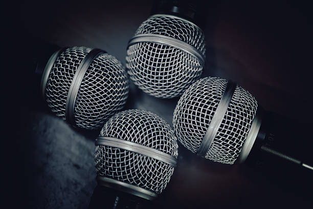 four microphones in conference room with vintage filter
