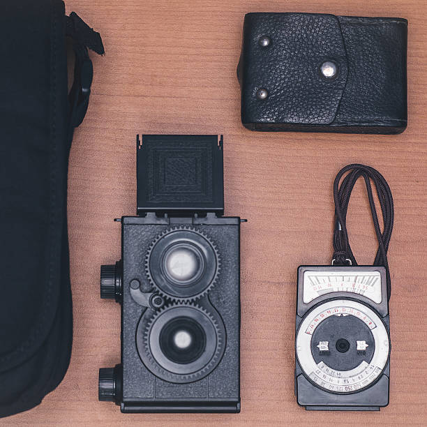 istock Retro photographer travel suitcase 614338322