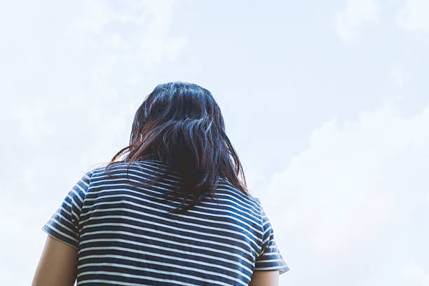 istock Woman under the blue sky 614339498