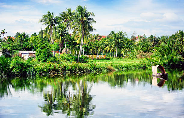 Rural landscape and small boat in Vietnam village. Composite photo