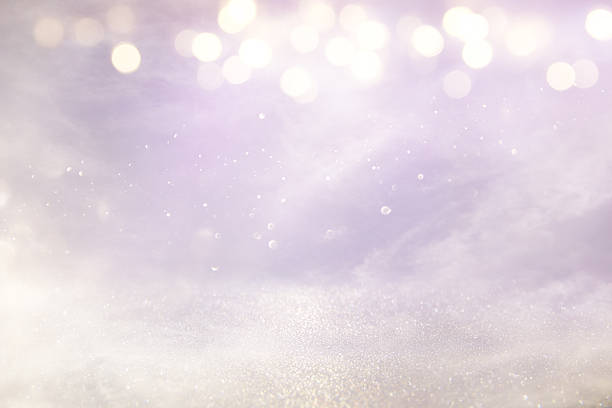 istock pink, light purple and silver abstract bokeh lights 614342534