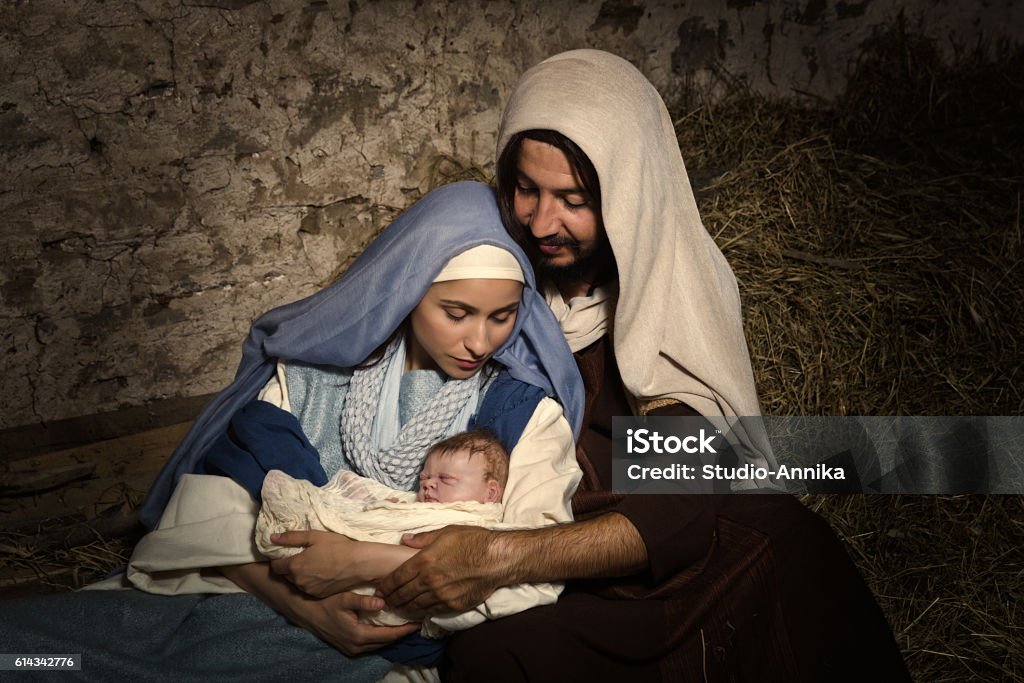 Baby Jesus in nativity scene Live Christmas nativity scene in an old barn - Reenactment play with authentic costumes.  The baby is a (property released) doll. Nativity Scene Stock Photo