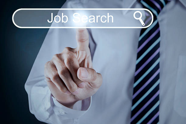 istock Businessman hand pressing job search button 614343192