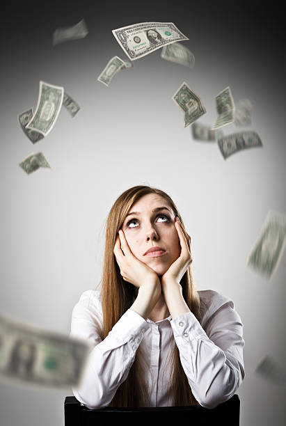 istock Woman in white and DOLLARS. 614343564