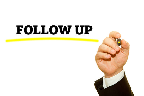 istock Hand writing Follow Up message with a marker. 614345316