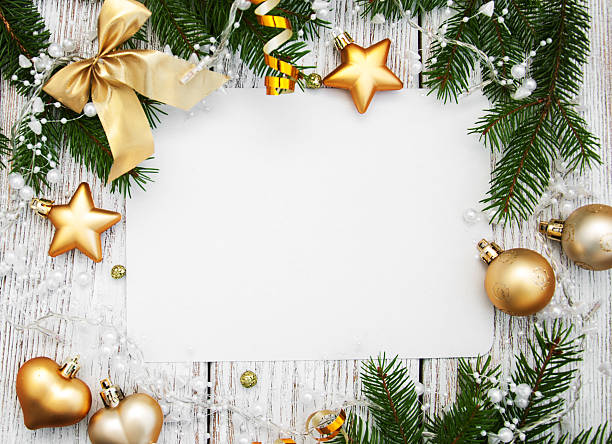 istock christmas background - blank paper with decoration 614347284