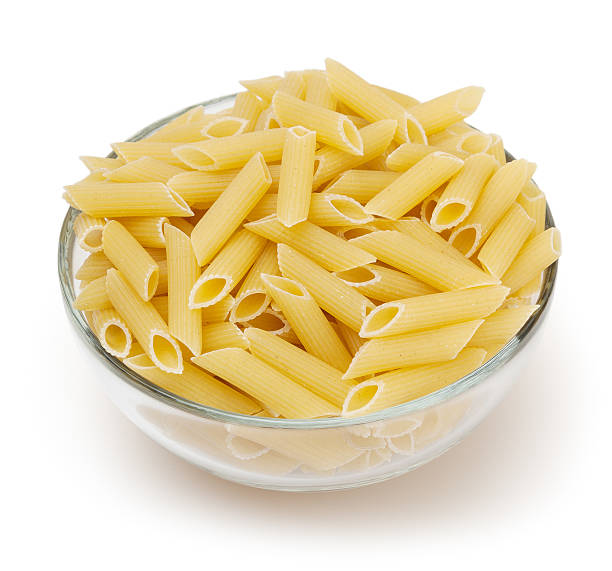 istock Penne pasta isolated on white background with clipping path 614348106