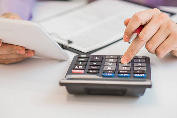 istock Cropped image of male accountant working with papers 614348422
