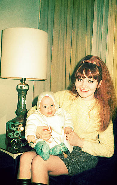 istock Vintage happy mom holding her son 614402994