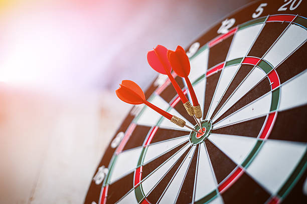 red three darts arrows in the target center