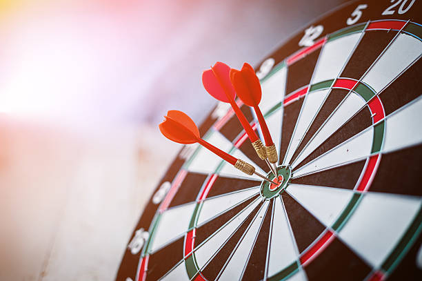 red three darts arrows in the target center red three darts arrows in the target center business goal concept dartboard photos stock pictures, royalty-free photos & images