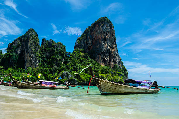 istock Long tail boats in Railay Bay 614403540