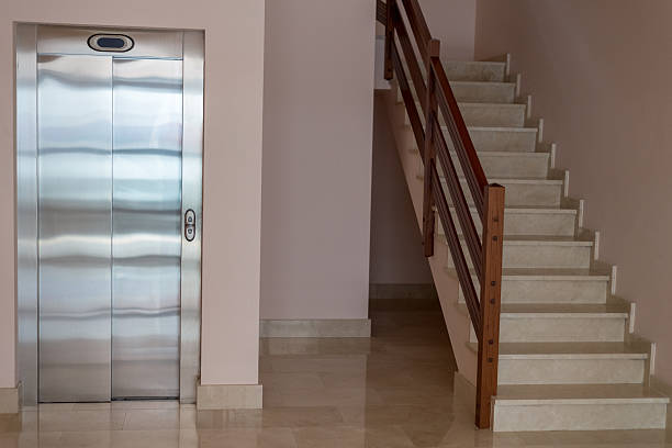 istock view of the staircase with elevator in apartment house 614407868