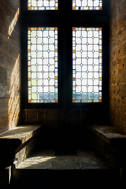 istock sunshine through colorful glass window 614408718