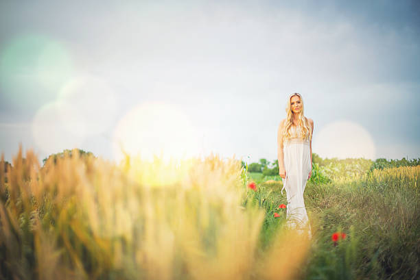 istock Blonde girl in field 614409078