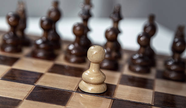 istock pawn opposition in the middle of the board. 614409160