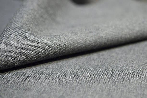 istock close up texture light gray fabric of suit 614409374