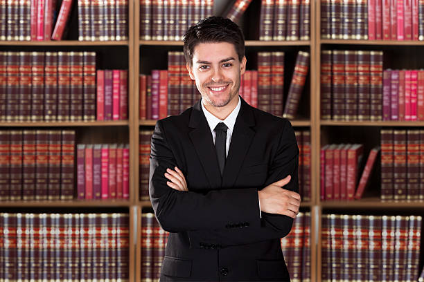 istock Confident Lawyer Standing Arms Crossed 614409574