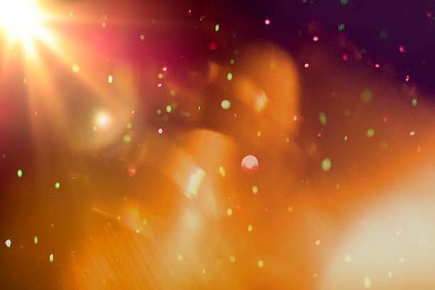 istock Abstract colorful bokeh light with light flare on black background 614410914