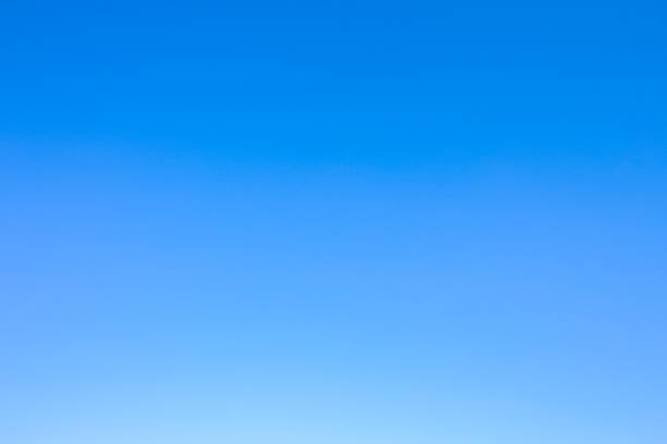 istock Clear blue sky as a background wallpaper, pastel sky wallpaper 614412254