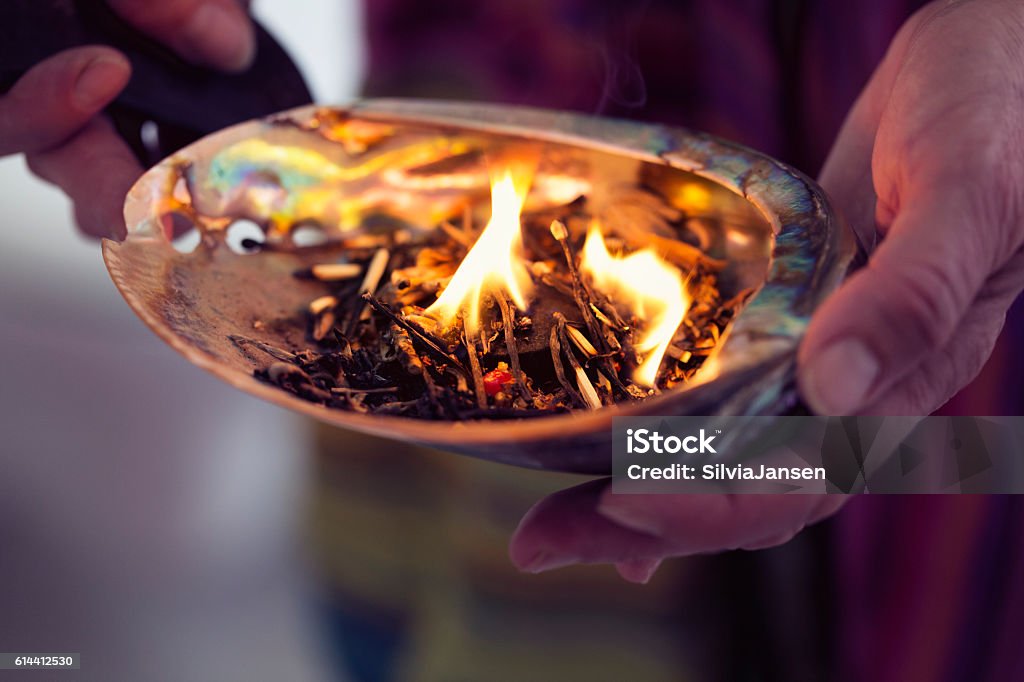 healing ceremony: burning incense in a shell Ceremony Stock Photo