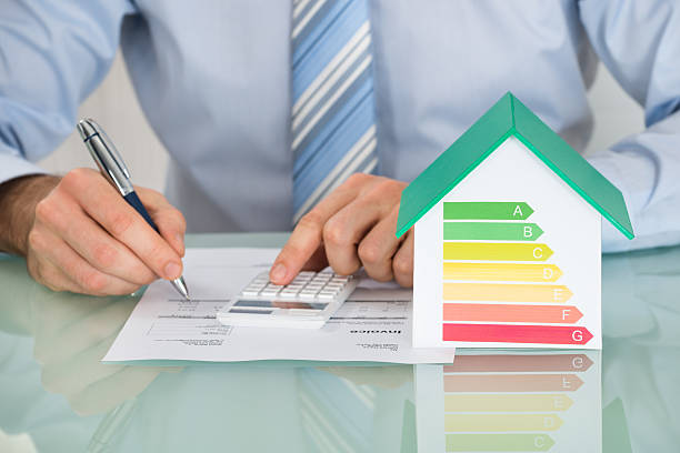 istock Businessman Calculating Energy Efficiency Rate 614413836