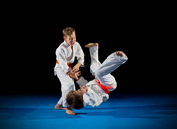 istock Little boys martial arts fighters 614414098