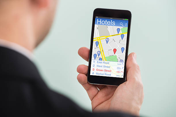 istock Person Searching Hotels On Smartphone 614415278