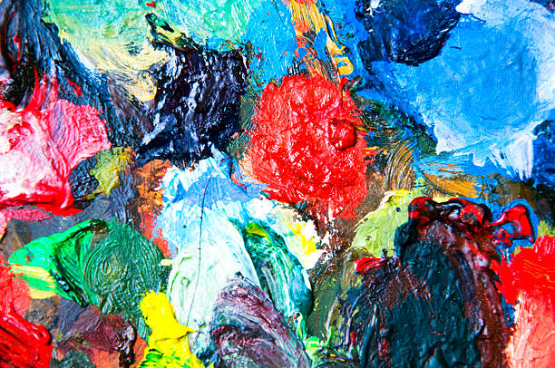 istock Oil paints multicolored closeup abstract background 614415382
