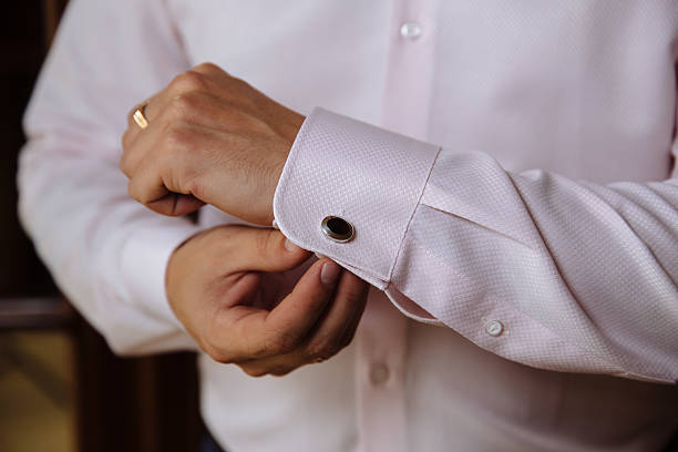 istock Businessman hands with cufflinks. Elegant gentleman clother 614415986