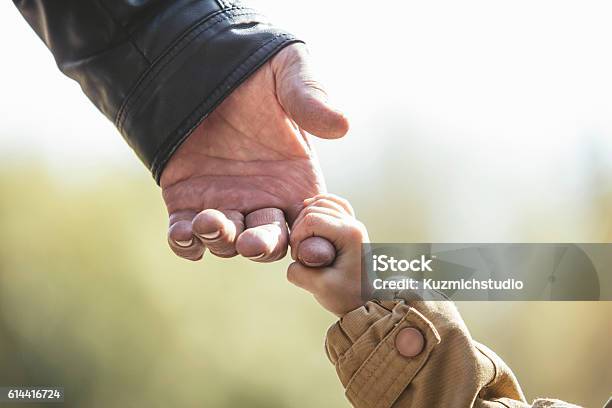 Baby Girl Warm Jacket And Cap C Grandfather Hands Stock Photo - Download Image Now - Grandparent, Grandfather, Grandchild