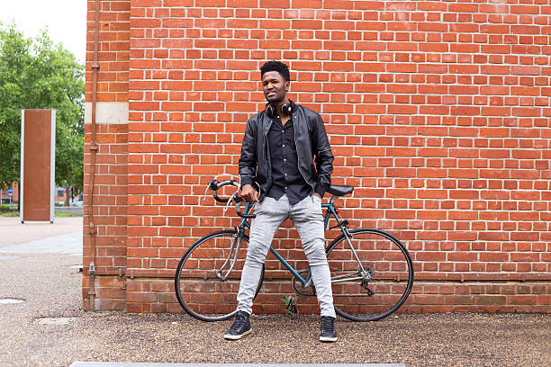 istock casual man with his bike 614418732