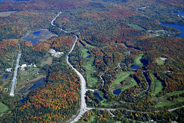 Muskoka golf course Autumn aerial view of a golf course with landing strip in the Muskoka region near  Deerhurst Huntsville,  during the fall season; Ontario Canada huntsville ontario stock pictures, royalty-free photos & images