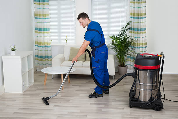 istock Worker Cleaning Floor With Vacuum Cleaner At Home 614420626