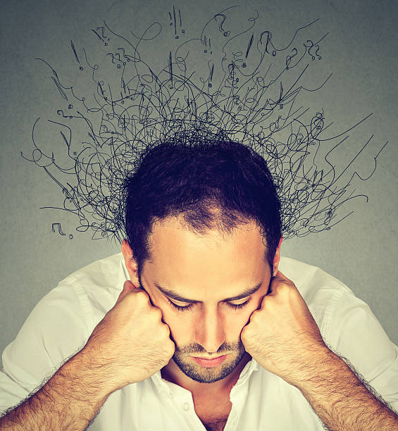 istock sad man with stressed face brain melting into lines 614420896