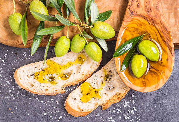 istock Olive oil and olives. 614421606