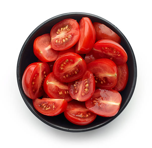 istock Bowl of tomatoes isolated on white, from above 614422188